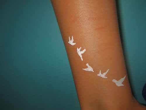 White Ink Tattoos On Dark Skin Fade Faster But There Are Other Ways to Get  an Equally Stunning Effect